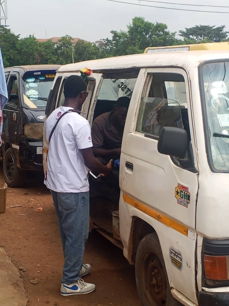 Team talking with a driver at Kaneshie