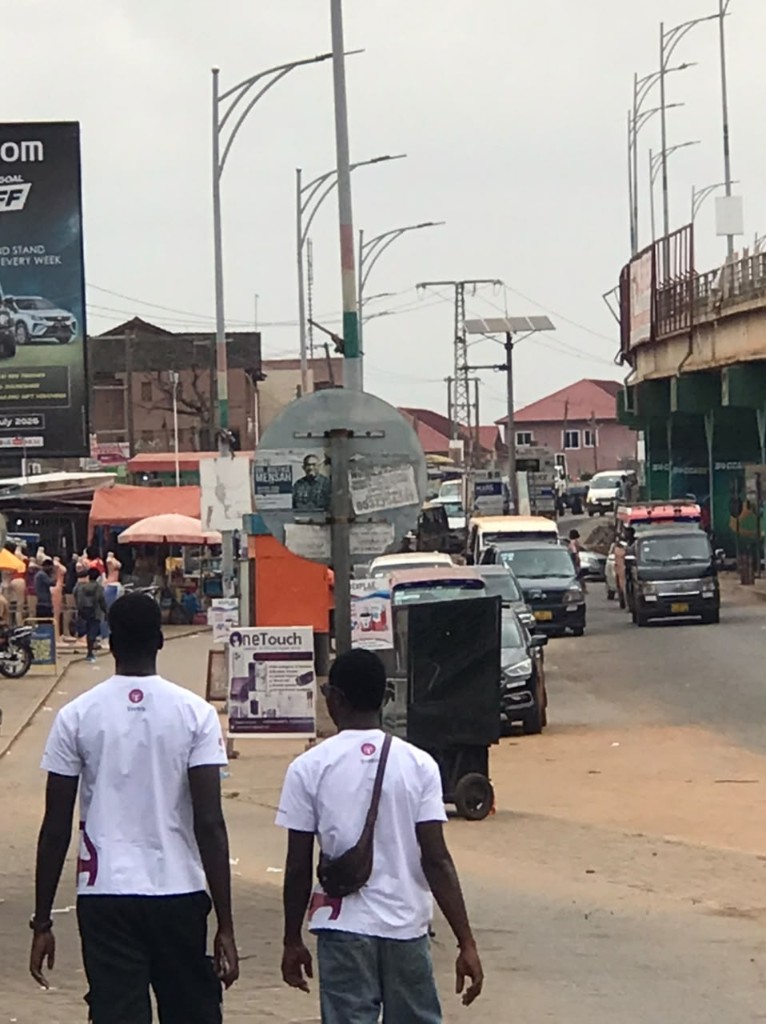 Trotro team members talking to a driver at his van